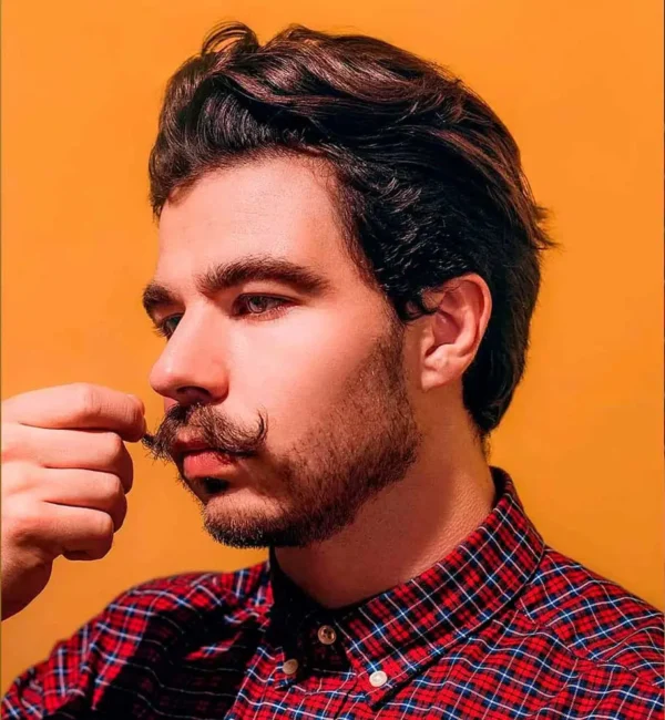 Men's curled mustache — a classic style in a modern look styled with Raider fixing balm.