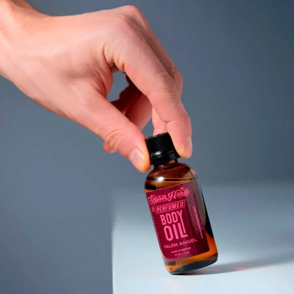 Fallen Angel perfumed dry body oil by Scissor Hands with notes of berries, vanilla, and patchouli.